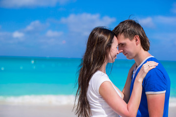 Fototapeta na wymiar Happy young couple enjoying summer holiday on tropical beach