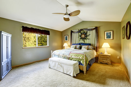 Bedroom interior decorated with wall art and curtains