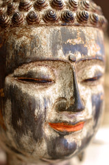 Colorful peaceful face of Buddha smiling