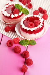 Delicious berry cakes on table close-up