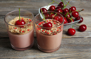 Tasty cherry dessert on wooden table
