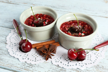 Tasty cherry dessert on table