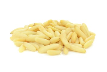 A pile of pine nuts on a white background