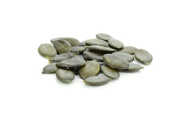 A pile of pumpkin seeds on a white background