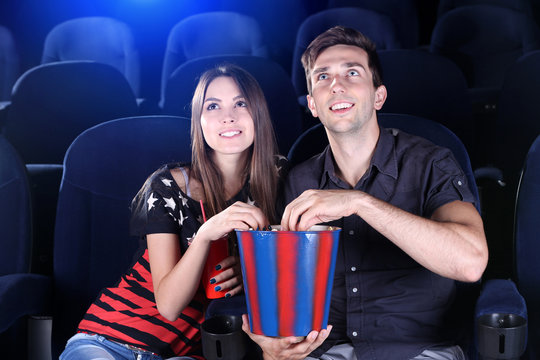 Young Couple Watching Movie In Cinema