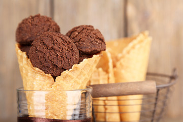 Tasty chocolate ice cream in waffle cone