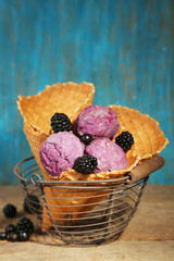 Tasty ice cream with berries in waffle cone