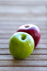 Juicy apples on wooden table, close-up