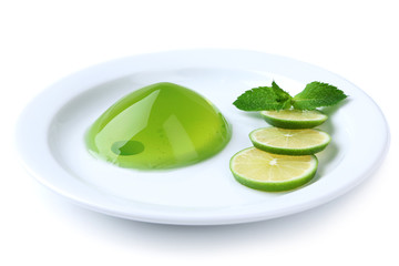Green jelly with mint leaves isolated on white