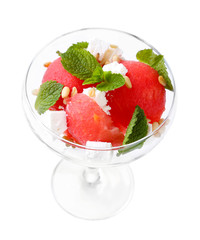 Salad with watermelon, feta and mint leaves in cocktail glass,