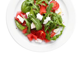 Salad with watermelon, feta, arugula and basil leaves