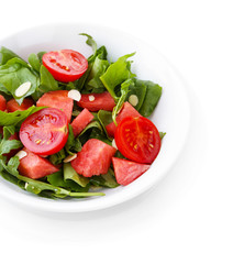 Salad with watermelon, onion, arugula and spinach leaves