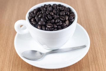 Coffee beans in coffee cup