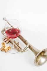 Red wine in a glass and old trumpet
