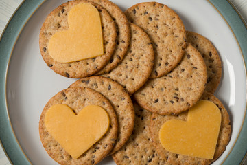 Heart shaped cheese on cracker