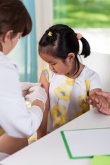 Asian girl during vaccine