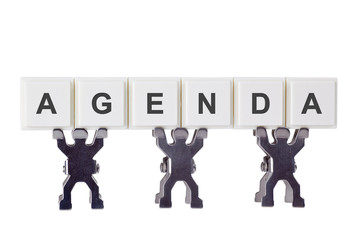 Figurine with the word AGENDA isolated on white background