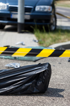 Corpse in bag after car accident
