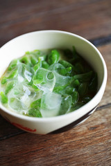close up thai dessert from rice and coconut cream in cup