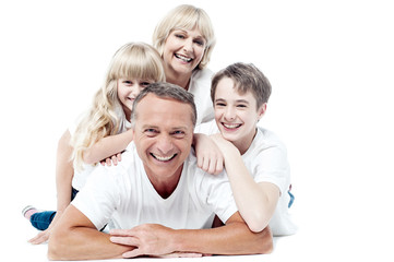 Cheerful family of four isolated on white