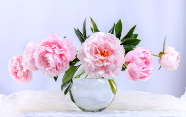 Still life with beautiful pink peonies in green vase