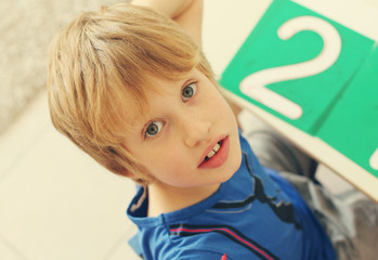 cute 6 years old boy drawing