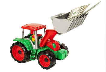 Red and green toy bulldozer with dollars