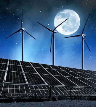 Solar Energy Panels And Wind Turbines In Night