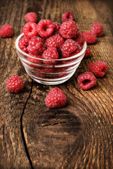 fresh raspberries on a wooden background