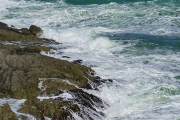 Stormy waves near a rocky shore