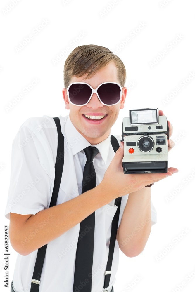 Poster geeky hipster holding a retro camera