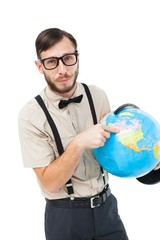 Geeky hipster pointing to globe