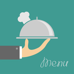 Fototapeta premium Hand with silver platter cloche and chefs hat. Menu cover. Flat