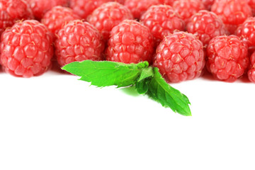 Ripe sweet raspberries isolated on white