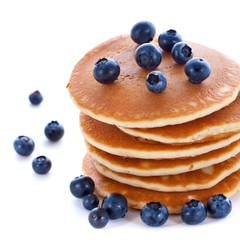 Stack of pancakes with fresh blueberries