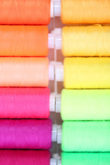 Multicolor sewing threads background