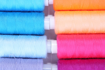 Multicolor sewing threads background