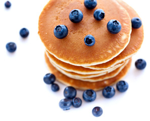 Stack of pancakes with fresh blueberries