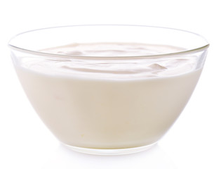 Glass bowl of yogurt isolated on white