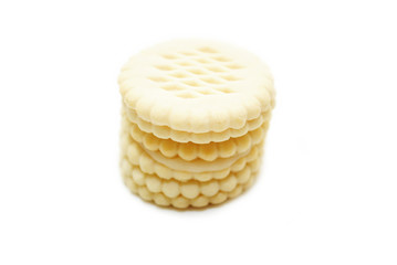 A Stack of Vanilla Wafer Cookies Over White