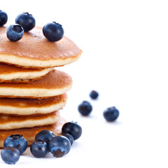 Stack of pancakes with fresh blueberries