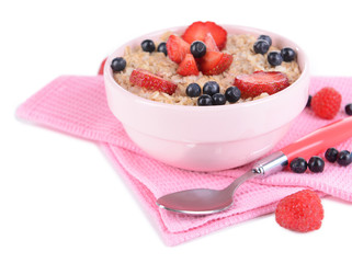 Tasty oatmeal with berries isolated on white