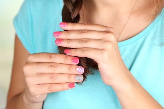 Female hand with stylish colorful nails, close-up,