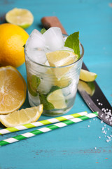 Fresh ingredients for mojito on old blue wooden table