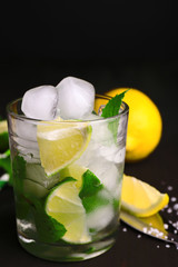 Fresh ingredients for mojito on old wooden table