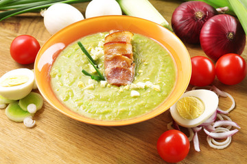 Leek soup on table, close up