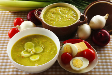 Leek soup on table, close up