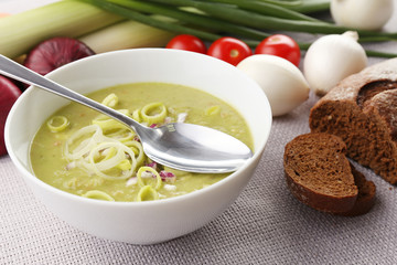Leek soup on table, close up