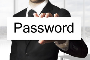 businessman holding sign password