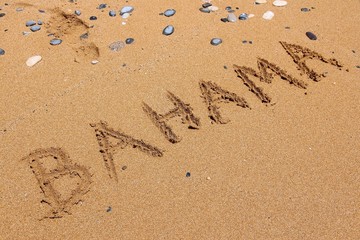 Bahama written on beach sand